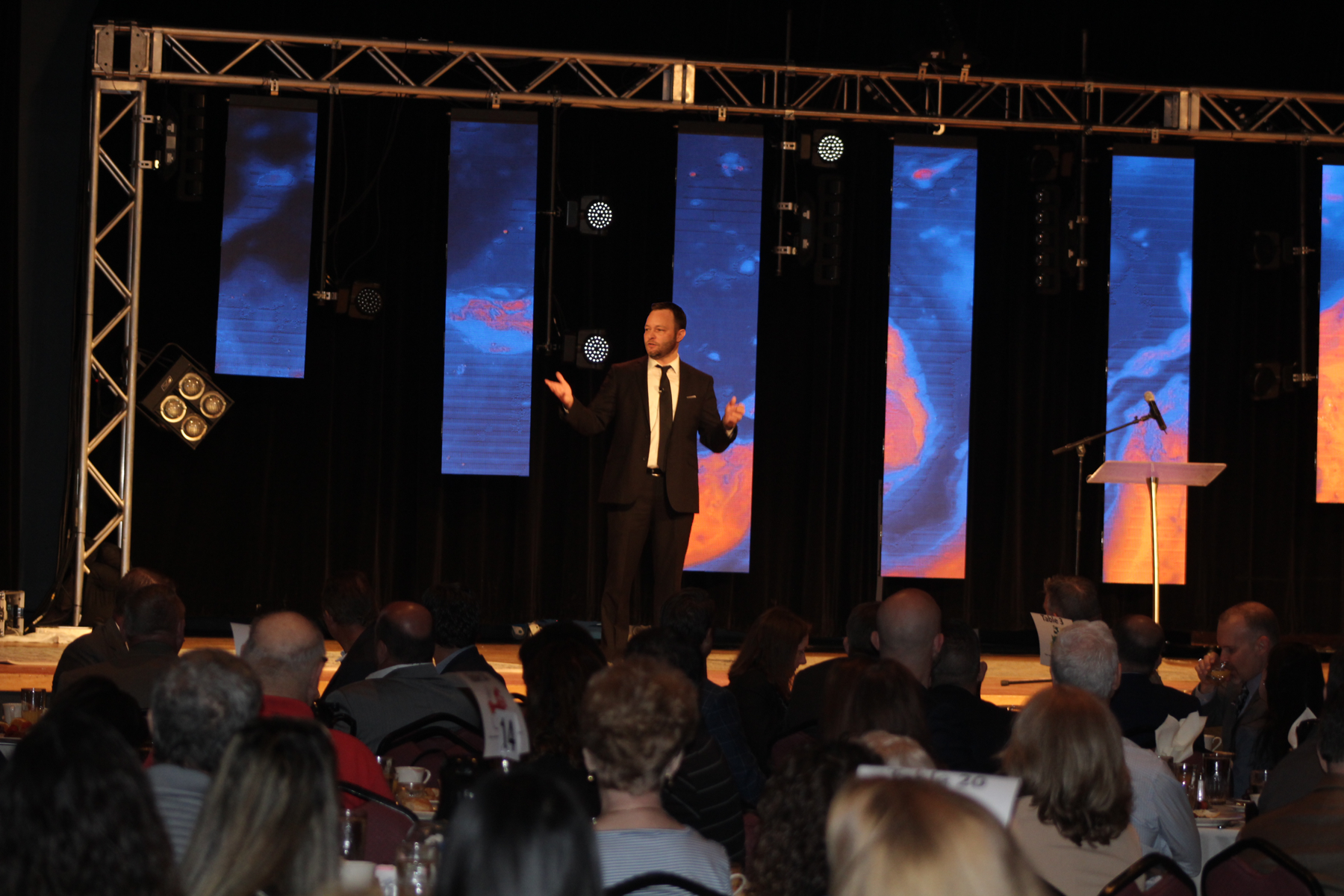 Lighthouse Vice President and Chief Sustainability Officer Kyle Johnson talking to the crowd at the breakfast