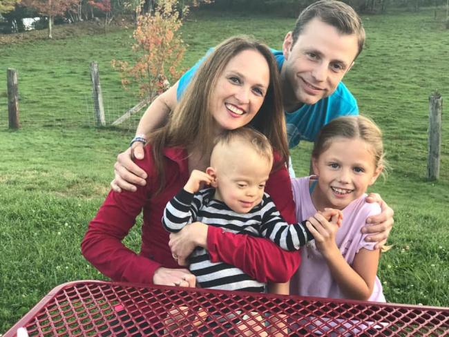 A family picture of the Naddeo family - Austin with his parents and sister