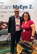 Elaine at a recent assistive tech conference with a physician consultant.