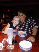 an image of Jessenia and her father sitting at a dinner table