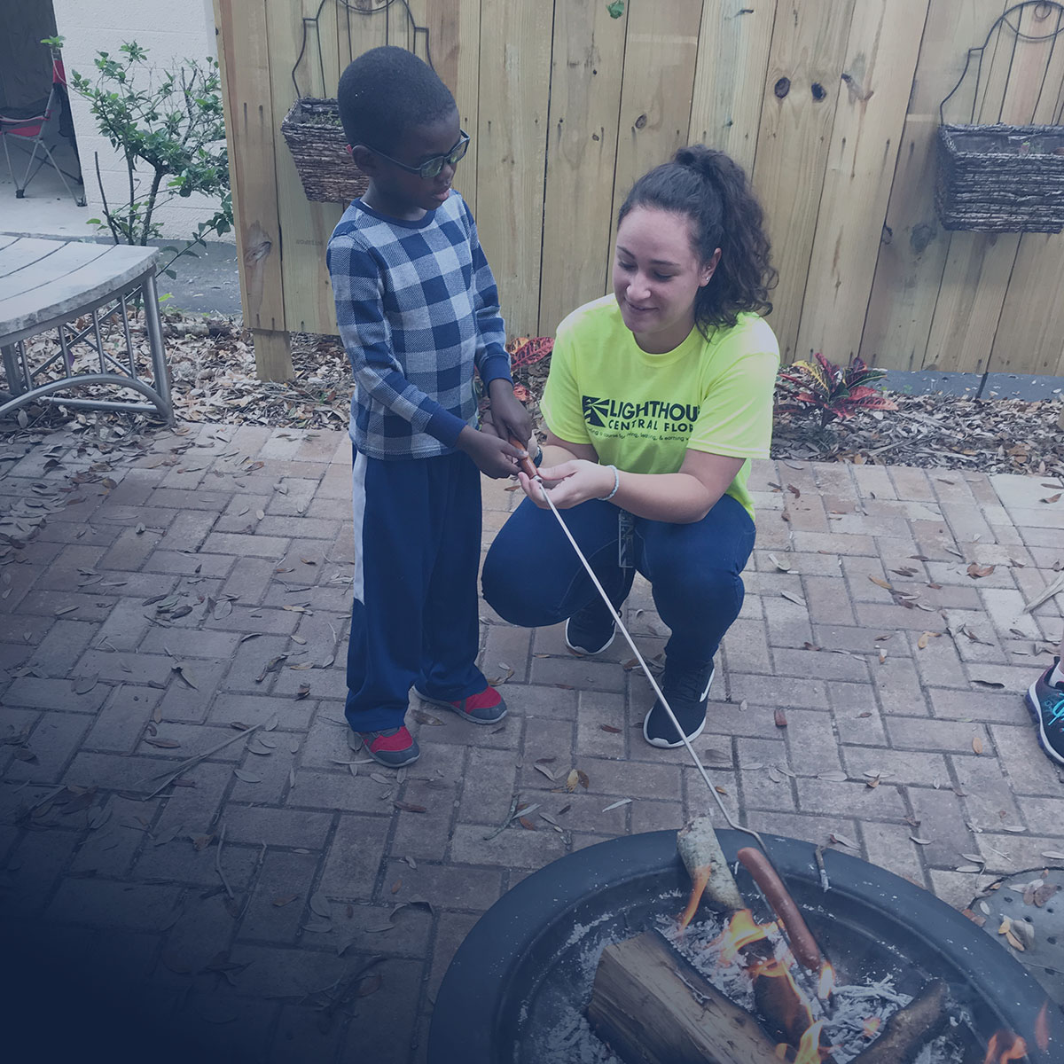 image of Lighthouse client, Jeremiah, learning to use a white cane