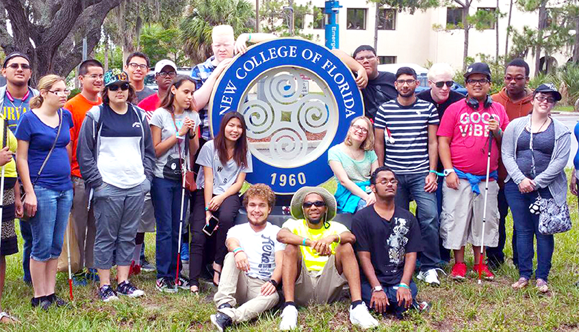 Image of a group of transition students posing for a picture in front of the New College of Florida